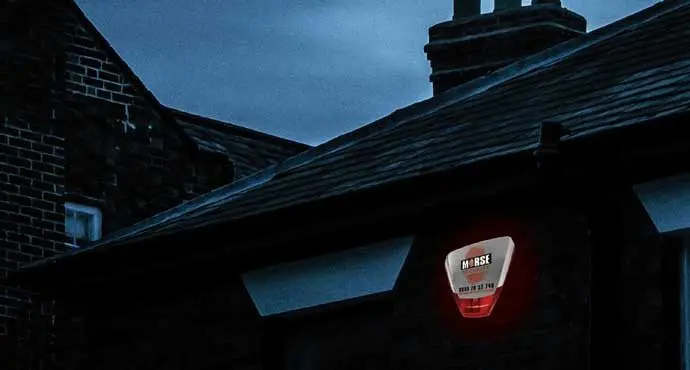 A house with a red light on the roof.